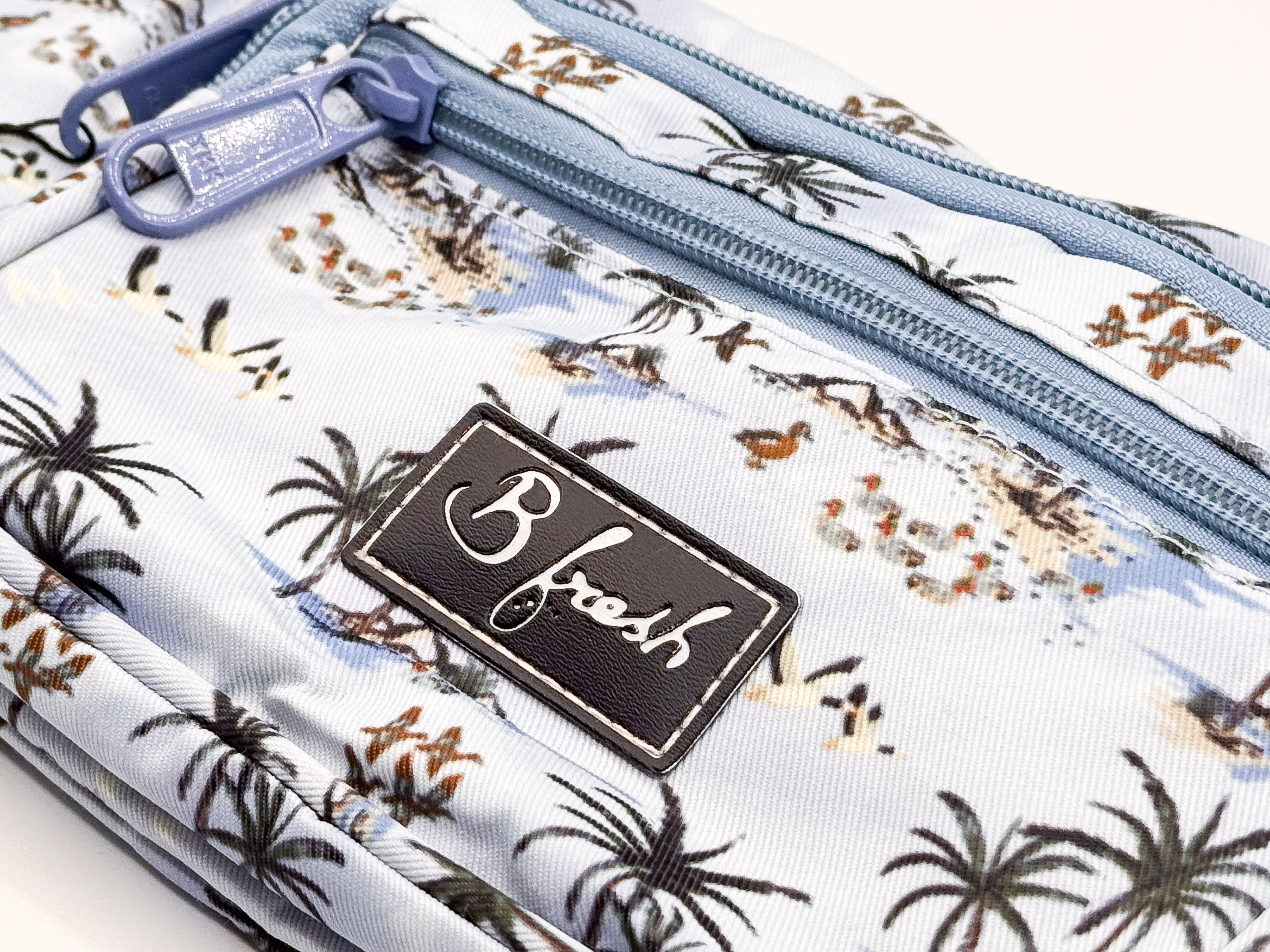 Pouch with tropical pattern and 'B fresh' brand tag 