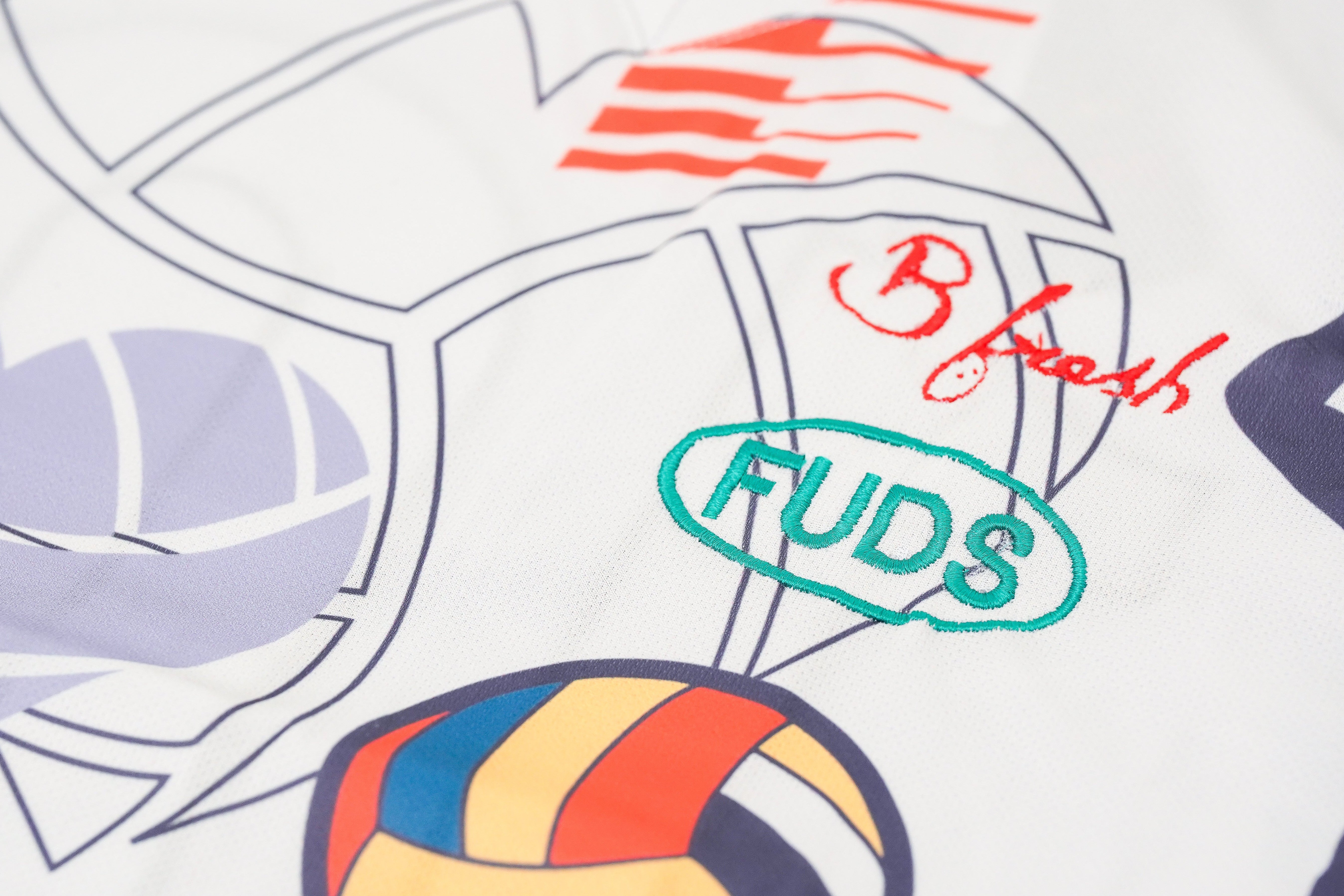 Colorful volleyball design with 'FUDS' logo and 'B flash' logos