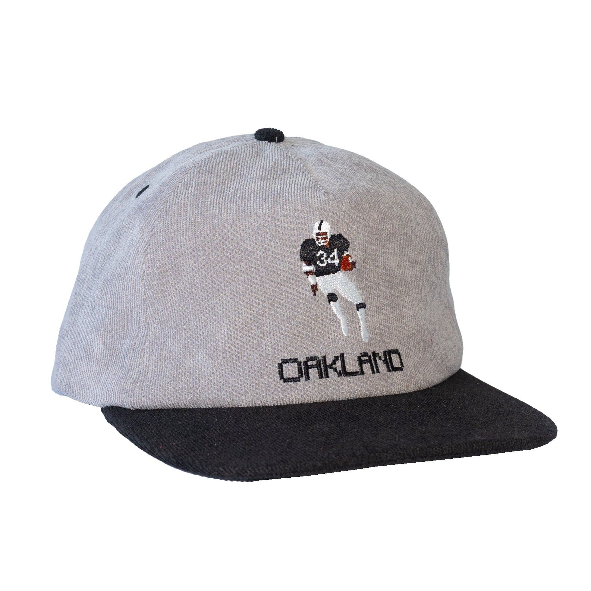 Gray and black cap with a football player illustration and 'Oakland' text on a white background