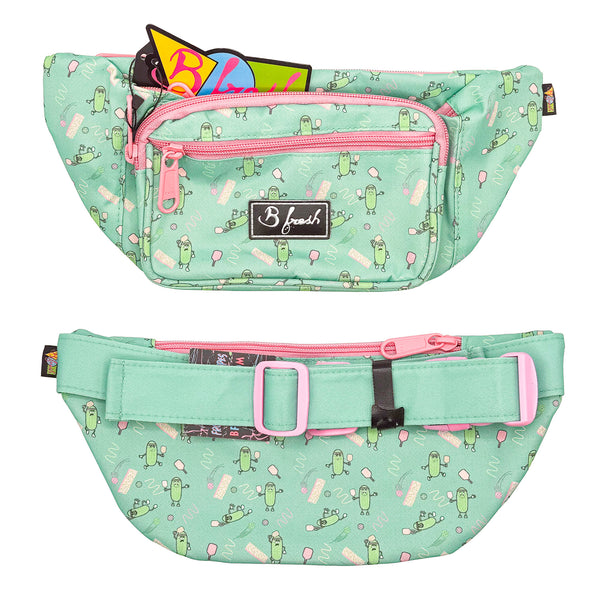 Mint green fanny pack with pink zippers and a pattern of cartoon pickles playing pickleball