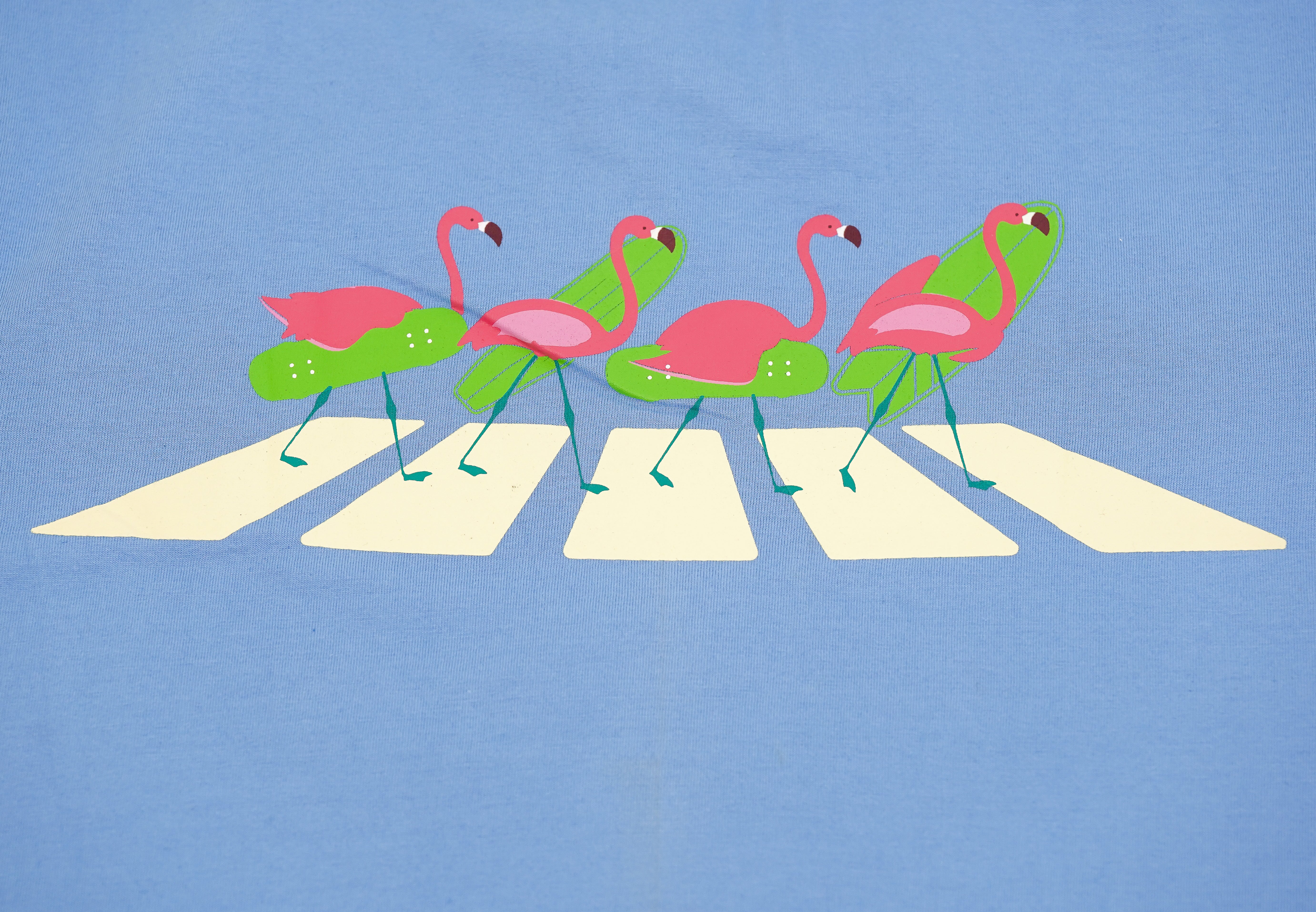Flamingo design on a blue background with a road pattern