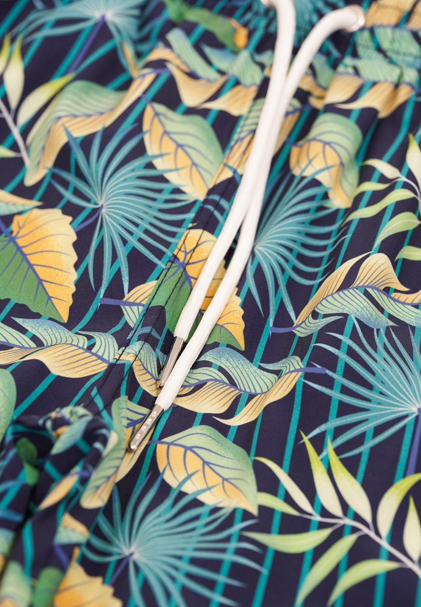 dark blue and green leafy shorts