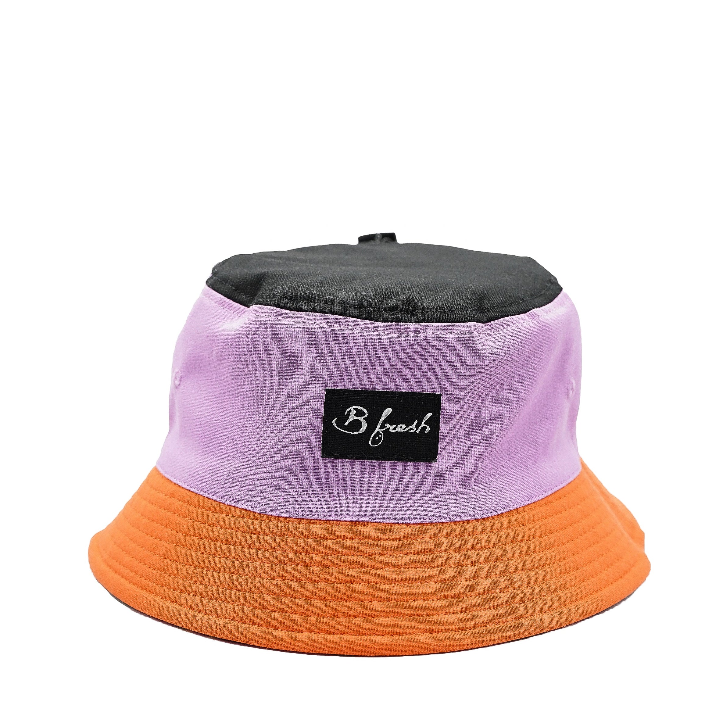 Color-blocked bucket hat with purple, orange, and black sections 