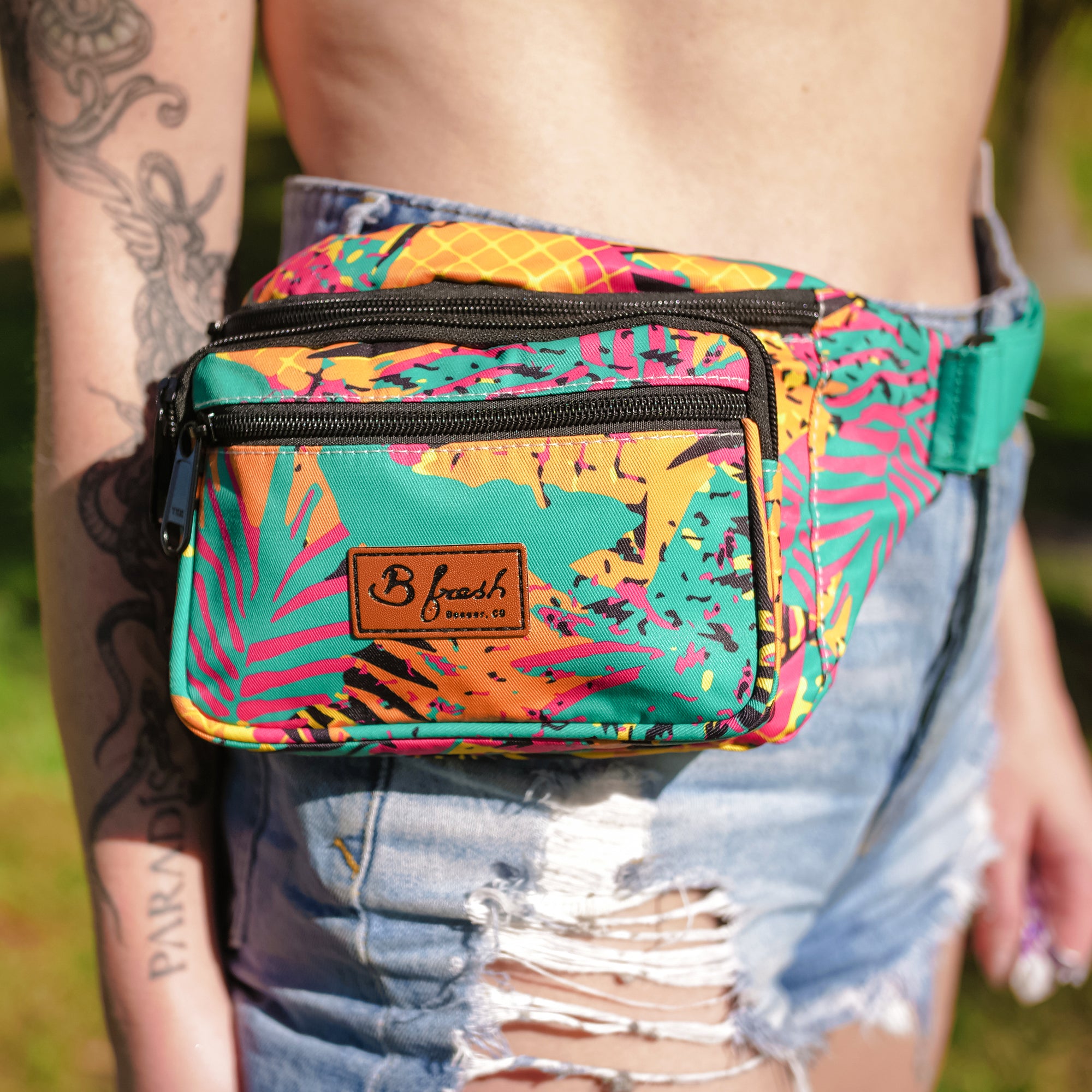 Super cool tropical summer jam style retro 90s design orange red green black fanny pack with 4 pockets. B Fresh Gear
